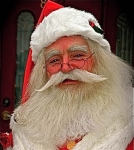 Santa Tom wearing a yak wig and beard