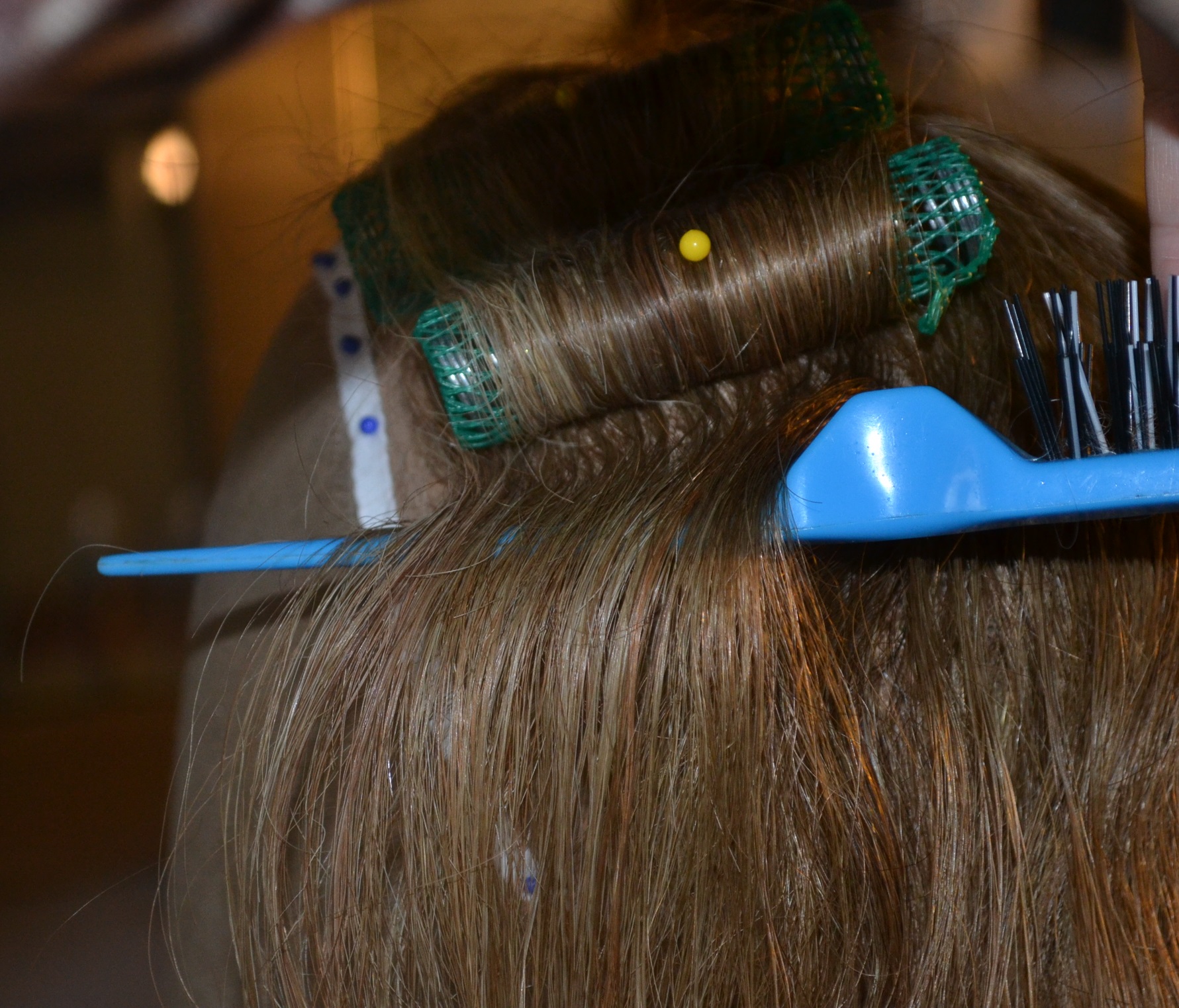 sectioning wig hair for a roller
