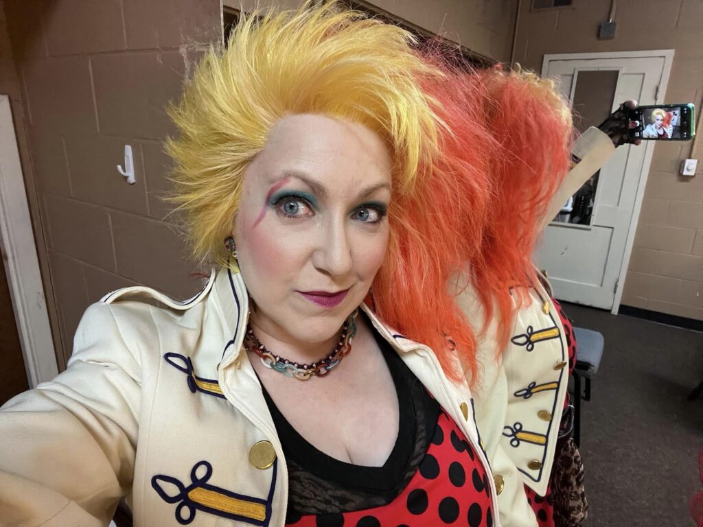 cyndi lauper tribute artist backstage, wearing a custom yellow and red wig